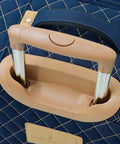Close-up of the lightweight aluminum handle on Queensbury 4 Piece Luggage Set Navy Expandable Spinner Suitcases