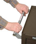 Close-up of 7-Drawer Rolling Tool Cabinet On Wheels With Chest, brown wrinkle finish, showing handle and raised edge top.