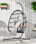 Egg Swing Chair With Stand For Outdoor Or Indoor Use, Hanging Chair With Cushioned Seat And Headrest In Light Gray on balcony