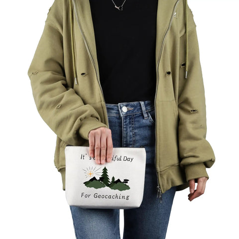 Person holding Geocaching Makeup Bag For Outdoor Lovers It Is A Beautiful Day For Geocaching Gift Beige Durable Canvas Zip Bag For Travel Gear