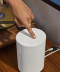 Era 100 SL Dope Compact Microphone Free Wireless Speaker with modern white finish, showcasing touch controls on tabletop.