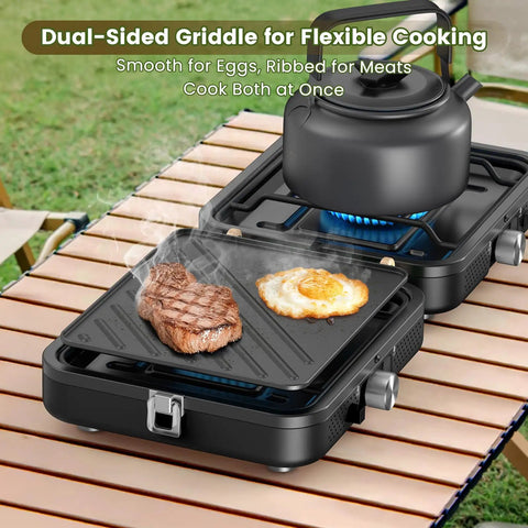 Two Burner Foldable Camp Stove With Dual Surface Griddle showing steak and egg cooking on grill next to teapot on burner
