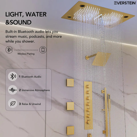 Luxury Ceiling Mount Shower System With Integrated Bluetooth Music Player And Brushed Gold Rainfall Panel, showing Bluetooth audio controls and waterfall.