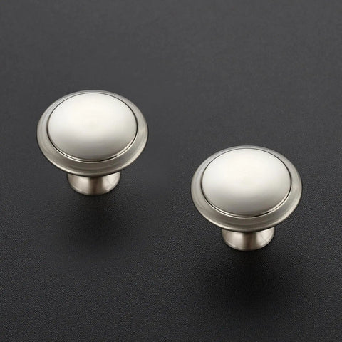 Kick Up Your Cabinets With These Fresh Brushed Nickel Knobs Breezy Install Hardware Kit Includes Mounting Screws Top view of two round brushed nickel drawer knobs.