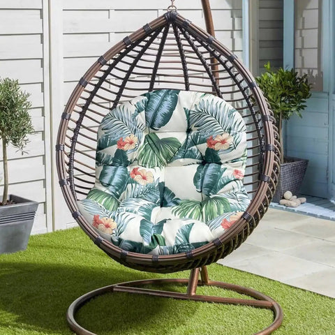 Waterproof Hammock Egg Chair Cushion For Indoor Outdoor Use with floral pattern in hanging basket on patio.