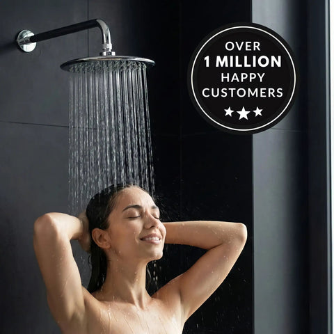 9 Inch Overhead Rain Shower Head With Self Cleaning Nozzles True Waterfall Drench High Flow Two Point Five GPM Chrome Finish Includes Ceiling Arm Extension For Spa Vibe Shower Experience in use, displaying water flow, with a person enjoying a relaxing shower.
