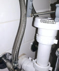 Air Admittance Valve and 1-1/2 Inch P-Trap Kit for Sink Drain, installed under a sink, white tubular venting system
