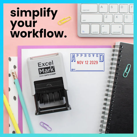Badass Date Stamp Featuring Custom Text Options And Dual Blue Red Ink With A Legit Gray Mount on a colorful desk backdrop.