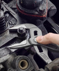 Hand using Cobra ES Extra-Slim 10 Inch Pump Pliers With Narrow Jaws for gripping round parts in machinery maintenance