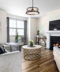 Dope Black And Gold 3 Light Drum Pendant Chandelier With Hollow Metal Shade, 15 Inch Round Ceiling Light in living room