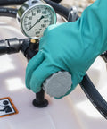 Person adjusting pressure gauge on Tow Behind Sprayer With 60 Gallon Capacity, 4 GPM Diaphragm Pump, 100 PSI