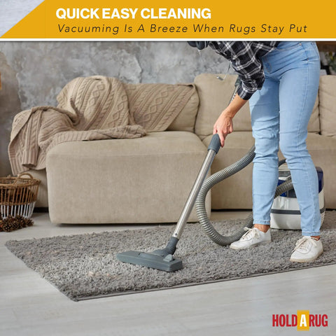 Person vacuuming rug on hardwood with Non Slip Rug Pad 6 Foot By 9 Foot One Eighth Inch Thick For Hardwood Vinyl Tile and Laminate Floors