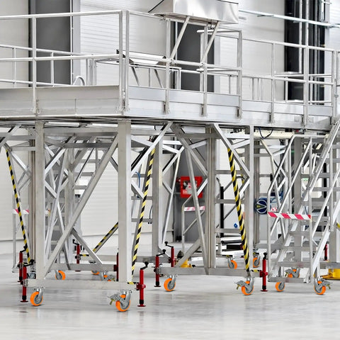 Ultra Heavy Duty 6x2 Inch Casters Kingpinless Crowned Polyurethane Wheels with aluminum core on a scaffold platform.