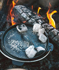 Pre Seasoned 2 Qt Cast Iron Dutch Oven With Flat Bottom For Stovetop And Campfire Use in campfire setting