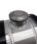 Close-up of two gallon aluminum spun round gas tank center fill cap with welded seams for trucks boats off-road