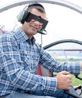 Pilot wearing Clip On View Limiting Device For Pilot Training With Cloud Over Visor Shields inside cockpit.