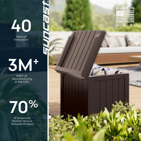 Java Resin 22 Gallon Outdoor Deck Box Weatherproof Storage Bin near plants on patio with open lid showing storage space