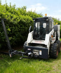 Skid steer with Beast Mode Sickle Bar Mower, 72-inch cutting length, 0.8-inch capacity for thick grass, weeds, saplings.
