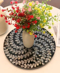 Hecka Smooth 13.4 Inch Round Lazy Susan Countertop Turnable Tray Featuring Mother Of Pearl Center And Black Wicker Boho Pattern For Kitchen Dining Or Bar Spaces with flowers in vase.