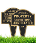 Heavy Duty Property Under Video Surveillance Sign For Outdoor Yard Warning 2 Pack 14 By 10 Inch Rust Free Aluminum Plate in grass.
