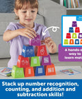 Child using Number Stackers Math Manipulatives Set For Kids, Hands On Addition And Subtraction Practice with stacking cups and cards.