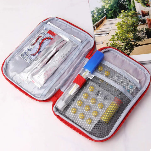 Open Two Pack Grab And Go First Aid Bag Portable Medical Kit showing compartments and medical supplies inside red 600D Oxford bag.