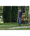 Person using V20 Cordless Leaf Blower Bare Tool Only For Hard Surface Cleanup, Delivers Up To 200 CFM And 90 MPH in yard