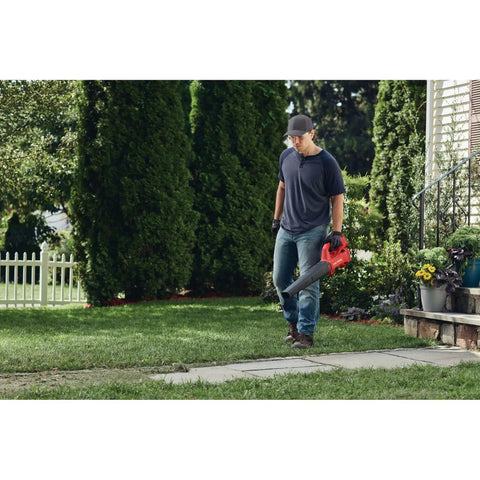 Person using V20 Cordless Leaf Blower Bare Tool Only For Hard Surface Cleanup, Delivers Up To 200 CFM And 90 MPH in yard