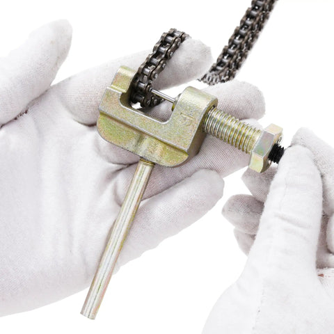 Close-up of 25H 62 Links Pro Grade Timing Chain Breaker Tool with chain in hands, used for Chinese ATVs, go-karts, dirt bikes.