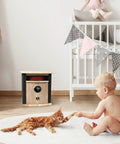 Portable Electric Space Heater That Cranks Up The Heat With 1500 Watt Infrared Quartz Elements next to baby and cat in nursery