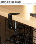 Close-up of clamp-on attachment for black 17-inch iron mesh rack under desk cords, Two Pack Clamp On Desk Cable Management Trays