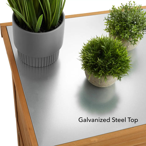 Top view of Outdoor Garden Potting Bench with metal tabletop and plants