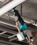 Worker using 18V LXT Brushless Cordless Reciprocating Saw Tool Only With Variable Speed Trigger And Toolless Blade Change for piping
