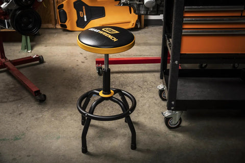 Adjustable Height Swivel Shop Stool With 360 Degree Rotation, 26 to 31 Inch Height in workshop setting