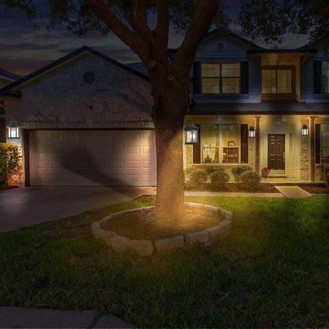 Illuminated house exterior with 2 pack black outdoor wall lanterns for front porch and exterior spaces, weatherproof aluminum sconce lights with clear glass.