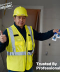Construction worker holding Adjustable Drywall Bit And Screw Gun Attachment with magnetic bit holder in a building site.