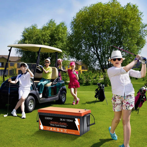 Group playing golf with 36V Lithium Golf Cart Battery 100Ah LiFePO4 with Built In Bluetooth 200A BMS on grass