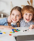 Children playing with Clear Classroom Spinners 10 Pack With Rotating Arrows For Dry Erase Math Games on a table