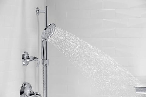 Forte All-In-One Handshower Kit With Slide Bar And 60-Inch Hose spraying water in polished chrome finish