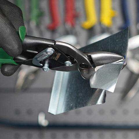 Midwest aviation snip set with green-handled left/right offset tinner shears cutting metal sheet