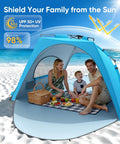 Family inside Pop Up Beach Tent Sun Shelter For 3 To 4 People, enjoying picnic, sky blue tent with UPF 30+ UV protection at the beach.