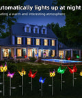 3 Pack Solar Butterfly Garden Lights Waterproof Led Color Changing Stakes illuminating yard at night with house in background