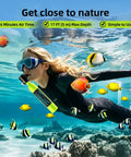 Woman snorkeling using Compact 0.5L Mini Scuba Tank Portable Reusable Underwater Breathing Pony Bottle With DOT Certification Green