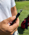 Close-up of a person holding a 335 Tip Golf Shaft Adapter Sleeve for Cobra Drivers Fits King F9 F8 F7 Fly Z Speedzone