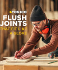 Craftsman measuring wood using Tongue And Groove Router Bit Set Pro Grade For Three Quarter Inch Stock With One Half Inch Cutting Depth.