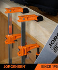 6 Inch Bar Clamp Set 2 Pack Steel F Clamp Light Duty 300 Lb Load Capacity Ideal For Woodworking Metalworking And DIY Projects Durable Grip For Secure Bonding And Easy Clamping displayed in workshop setting