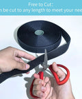 Heavy Duty Sew On Hook And Loop Tape With Rock Solid Grip For Clothes Gear And Crafting showing cutting black nylon tape with scissors.