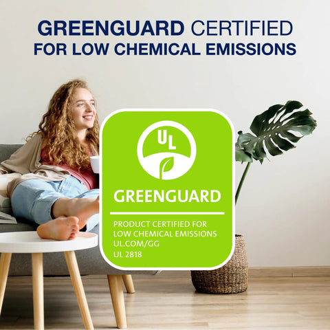 GreenGuard certified logo for low chemical emissions next to a relaxed woman on a sofa with a plant and table nearby.