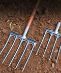 Heavy Duty High Carbon Steel Digging Fork For Garden Use, shown with two spading fork heads on soil, featuring anti breakage design