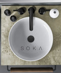Overhead view of 8 To 16 Inches Widespread Matte Black Bathroom Faucet With Two Handles, Sleek Modern Industrial Vanity Sink Faucet, Three Hole Install No Fuss, Pop Up Drain, Built Tough Stainless Steel, Great For Home Or Commercial Use on a stone countertop.
